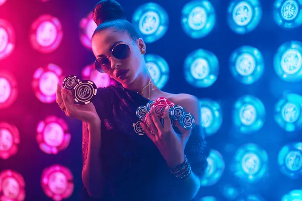 A man focused on his laptop with live stats in the background, highlighting the dedicated sports and gaming features of the CROWNDB mobile app.