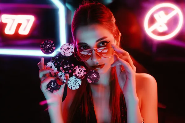 A close-up shot of golden coins falling around a spinning roulette wheel, representing immersive casino action at CROWNDB.