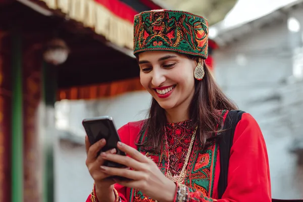 CROWNDB Member Login — Return to your personalized dashboard A person using their device against a moody casino-themed background, illustrating the smooth re-entry process at CROWNDB.